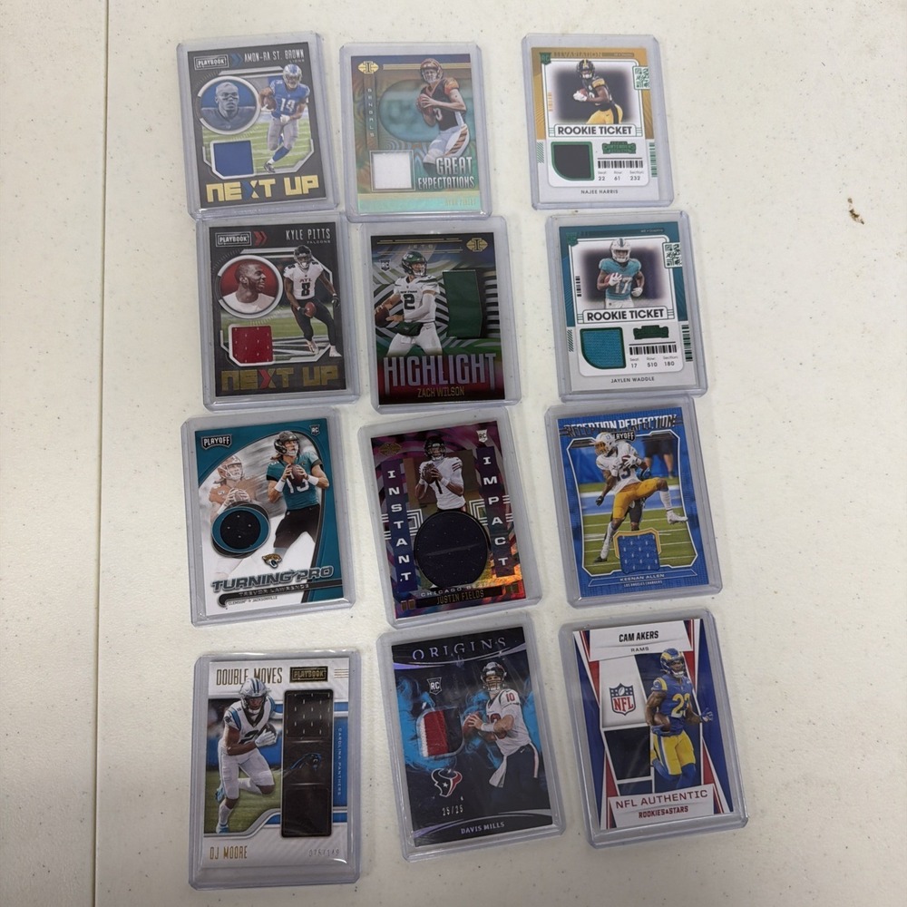 twelve NFL football trading cards in protective top loaders Patch Cards